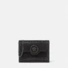 La Medusa-pyntet satengclutch