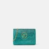 La Medusa-pyntet satengclutch
