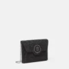 La Medusa-pyntet satengclutch
