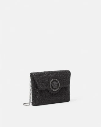 La Medusa-pyntet satengclutch