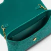 La Medusa-pyntet satengclutch